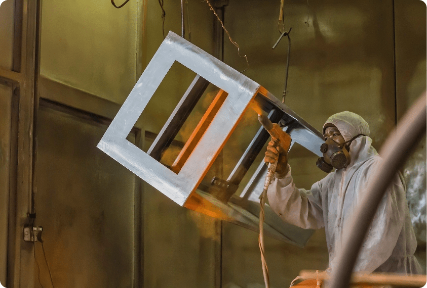 An individual engaged in composite work, representing the need for our dust collection systems.