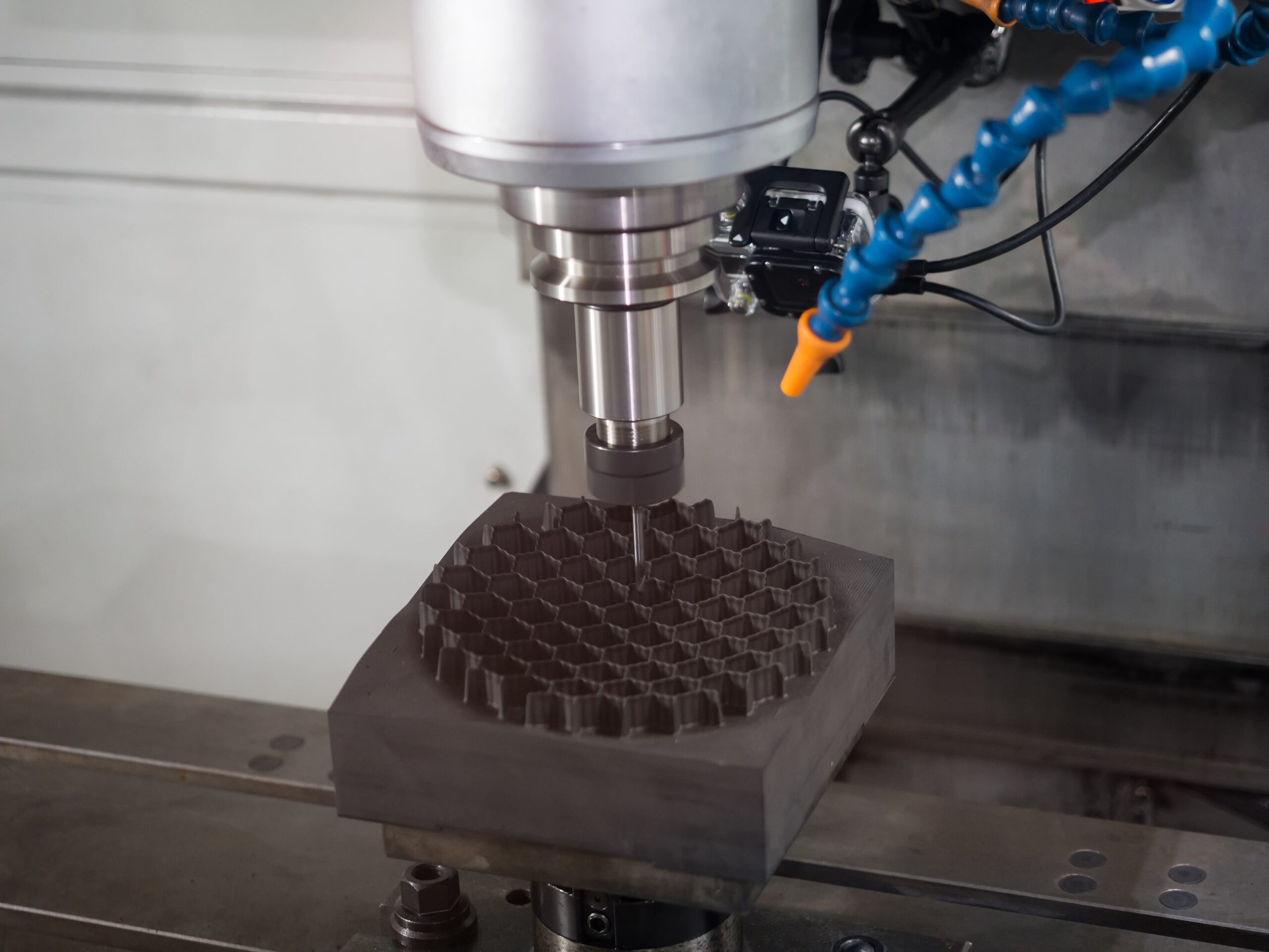 Machine undergoing composite transformation, emphasizing the need for a dust collector and fume extractor.