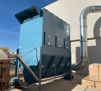 Belfab's outdoor dust collector installed outside a factory.