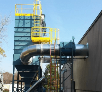 Belfab's large-scale dust collector installed outside a workshop.